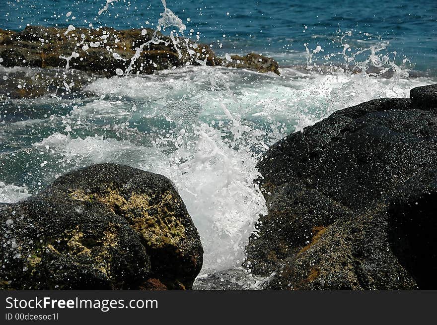 Ocean waves spraying against an Azores Island coastline. Ocean waves spraying against an Azores Island coastline