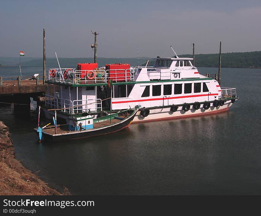 Empty motorboats standing near a jetty.