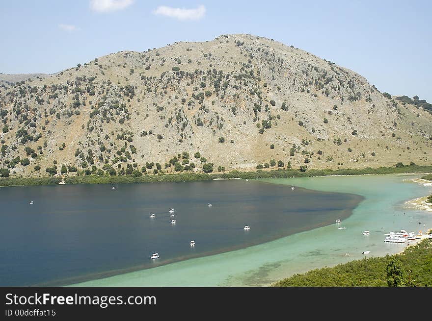 Crete Lake Kournas with sailing boats and mountain