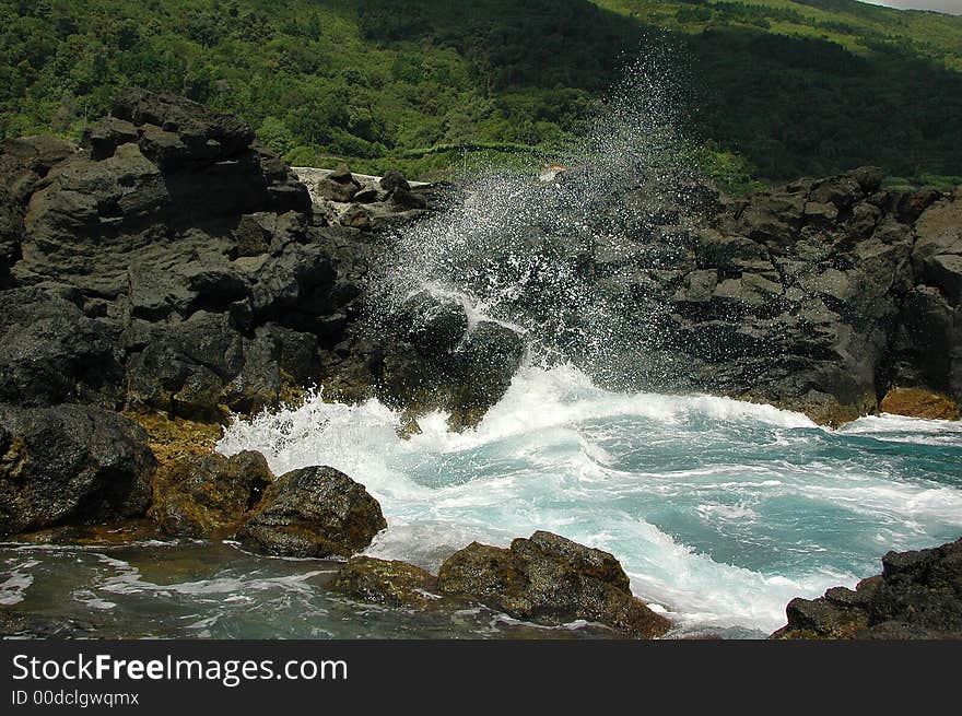 Ocean waves spraying against an Azores Island coastline. Ocean waves spraying against an Azores Island coastline