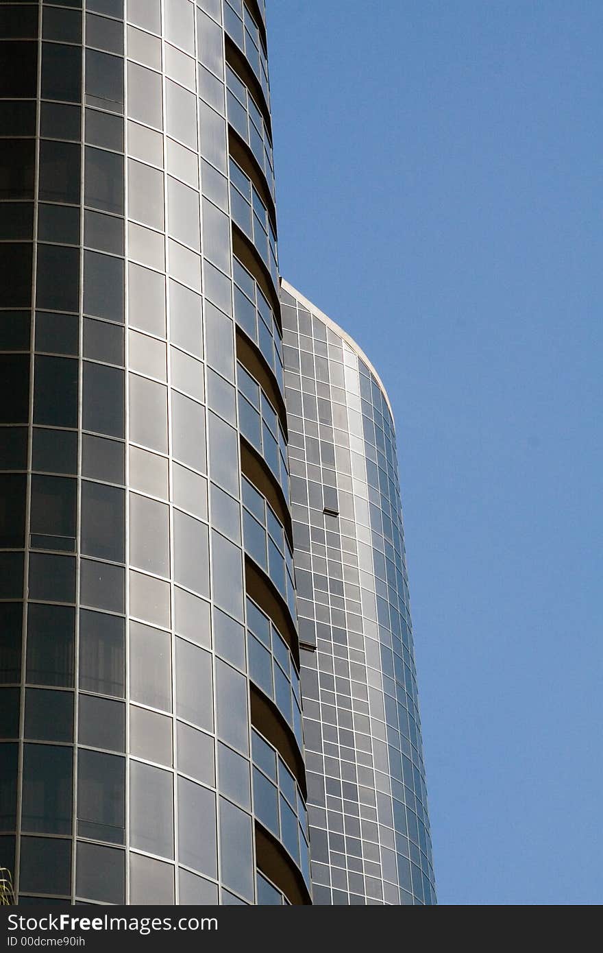 Modern skyscrapers against a bright blue sky