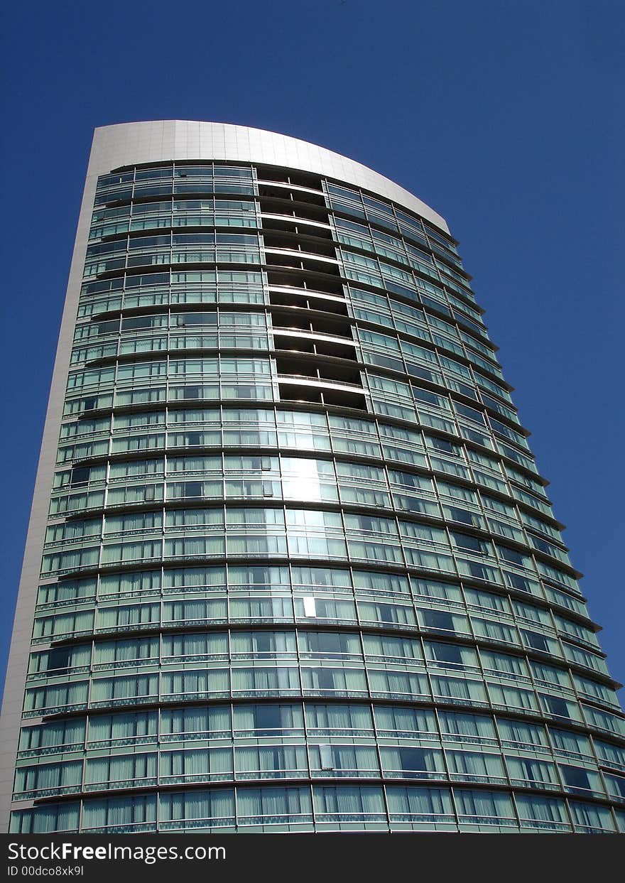 Modern skyscrapers against a bright blue sky