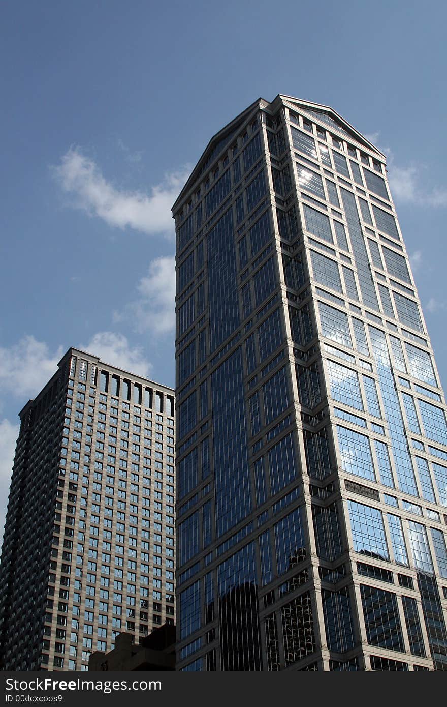 Modern skyscrapers against a bright blue sky