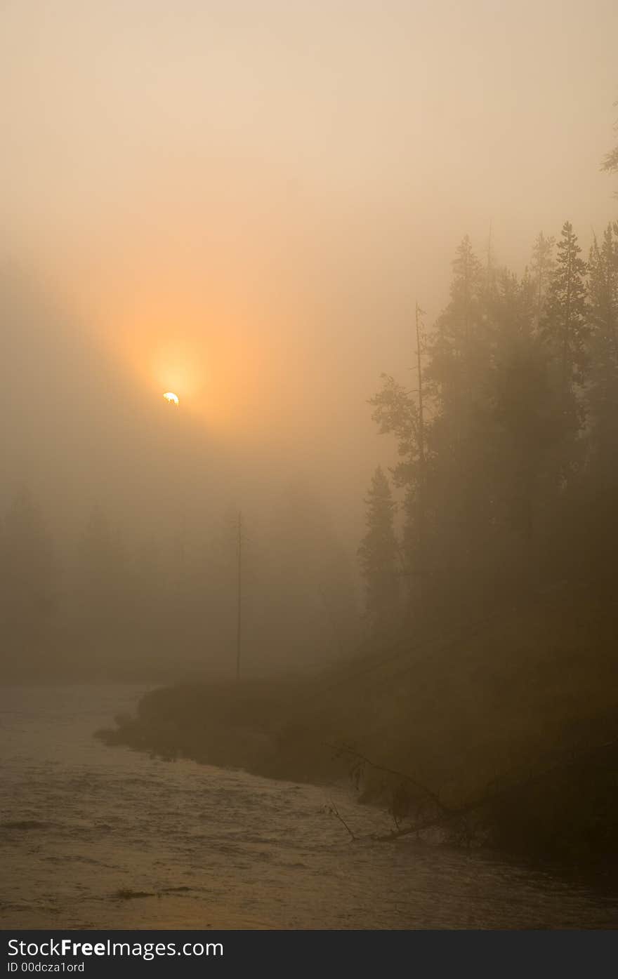 The sun rises over the mountains in Yellowstone National Park. The sun rises over the mountains in Yellowstone National Park