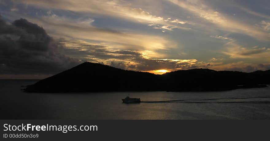 Caribbean island and boat at sunset. Caribbean island and boat at sunset