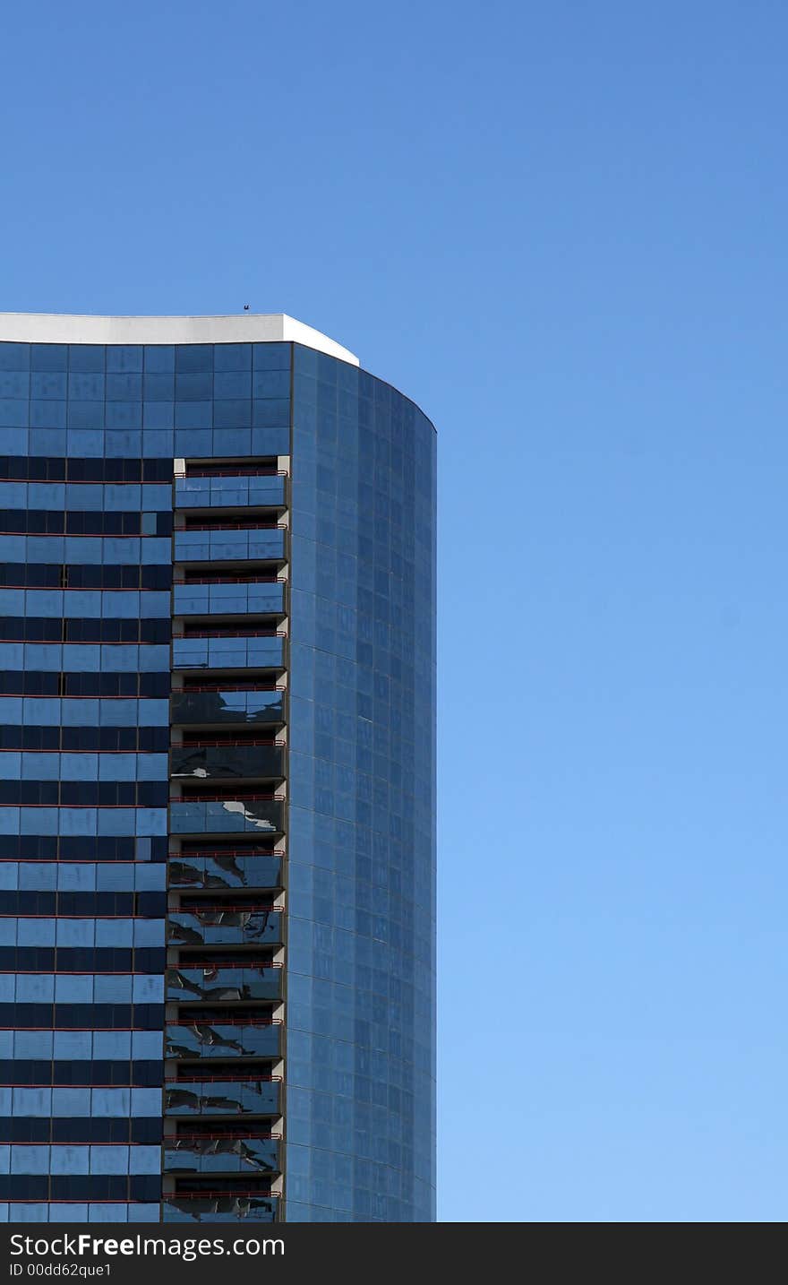 Modern skyscrapers against a bright blue sky