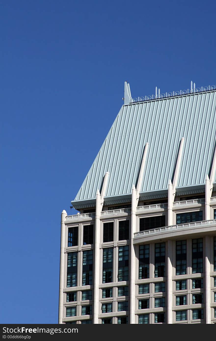 Modern skyscrapers against a bright blue sky