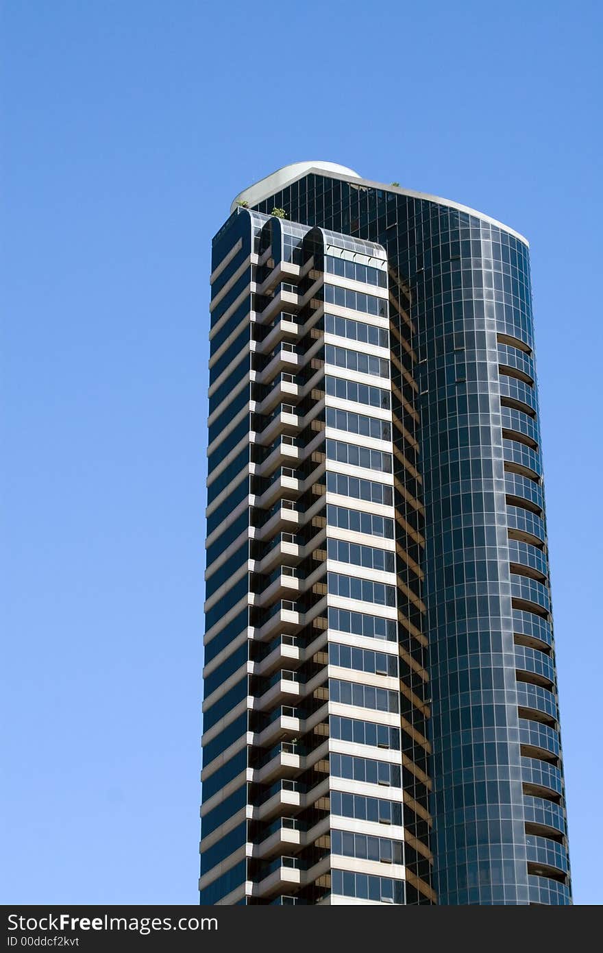 Modern skyscrapers against a bright blue sky