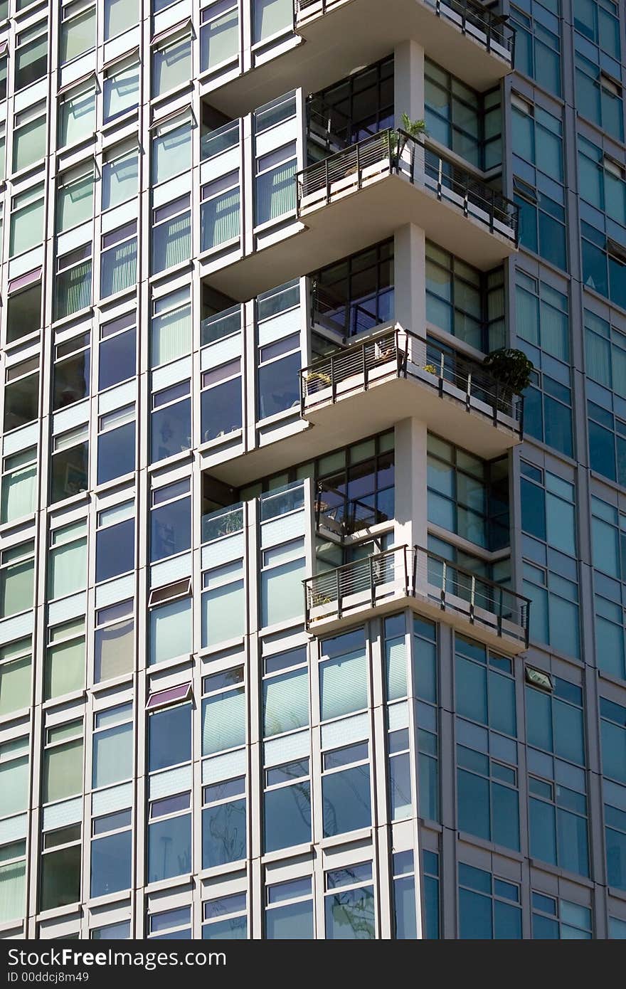 Blue sky reflected in a glass office building. Blue sky reflected in a glass office building