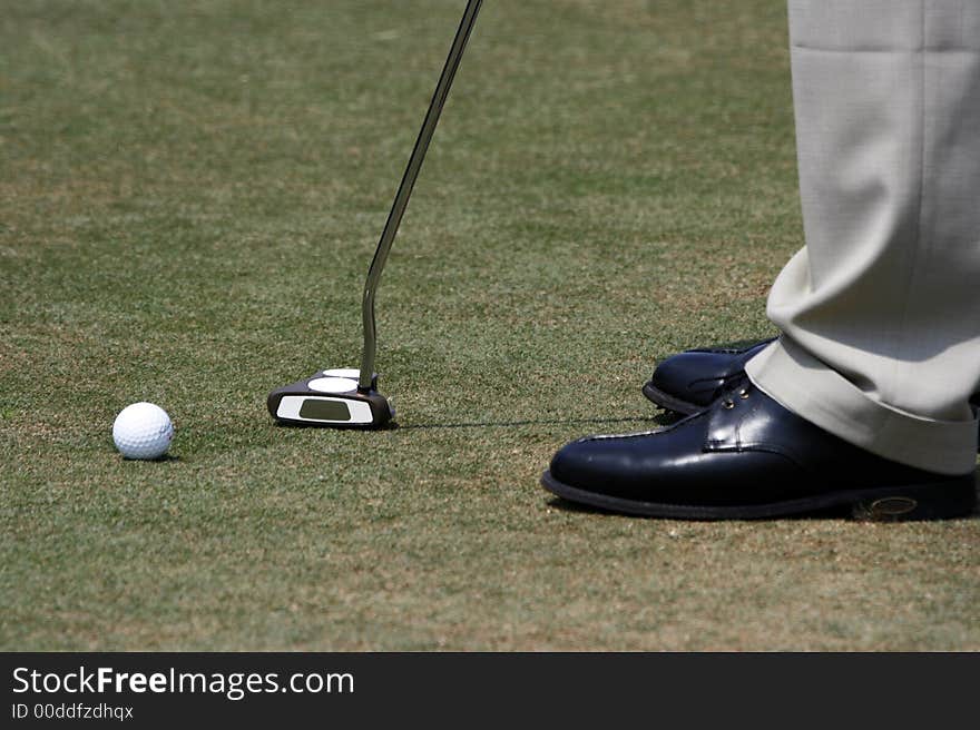 A golfer playing golf in the field.