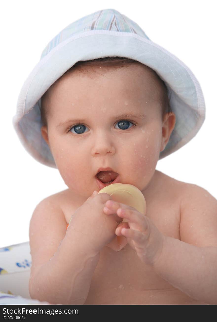 Cute baby in a hat taking a bath. Cute baby in a hat taking a bath