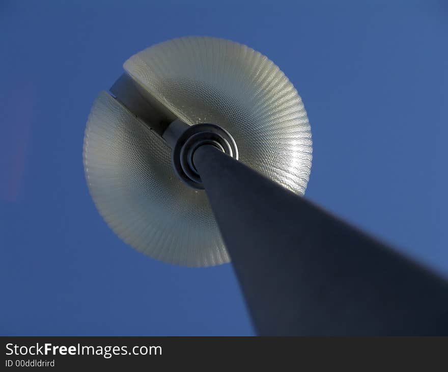 White round lamp on the blue sky background