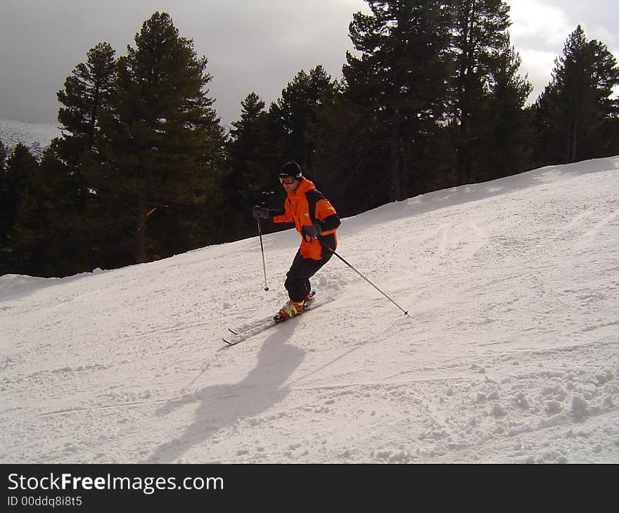 Skier on snow covered slope