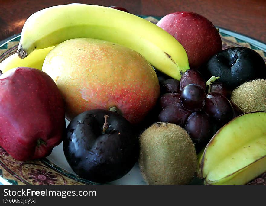 A nice arrangement of fresh fruit in a bowl. A nice arrangement of fresh fruit in a bowl