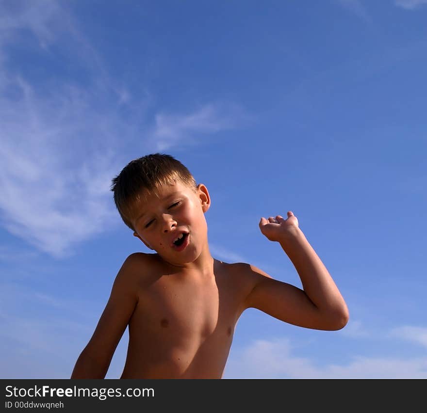 Young boy with a sky background