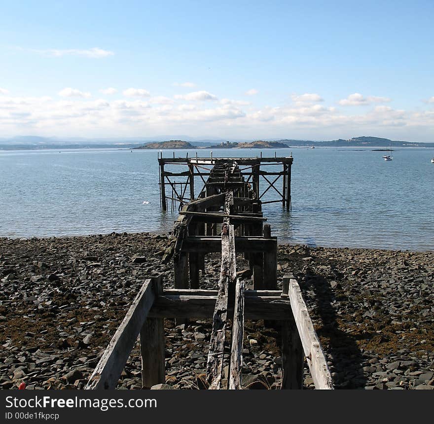 Old broken jetty in aberdour on the east coast of scotland. Old broken jetty in aberdour on the east coast of scotland