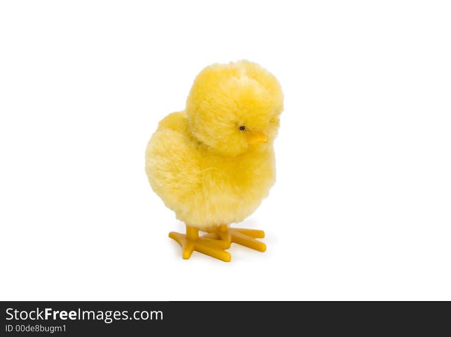 Little yellow baby chick toy isolated over white background