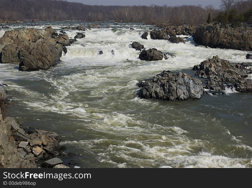 The Potomac river plunges over the rocks at Great Falls Virginia. The Potomac river plunges over the rocks at Great Falls Virginia