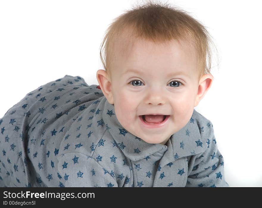 A cute baby in gray and blue stars on a white background smiling. A cute baby in gray and blue stars on a white background smiling