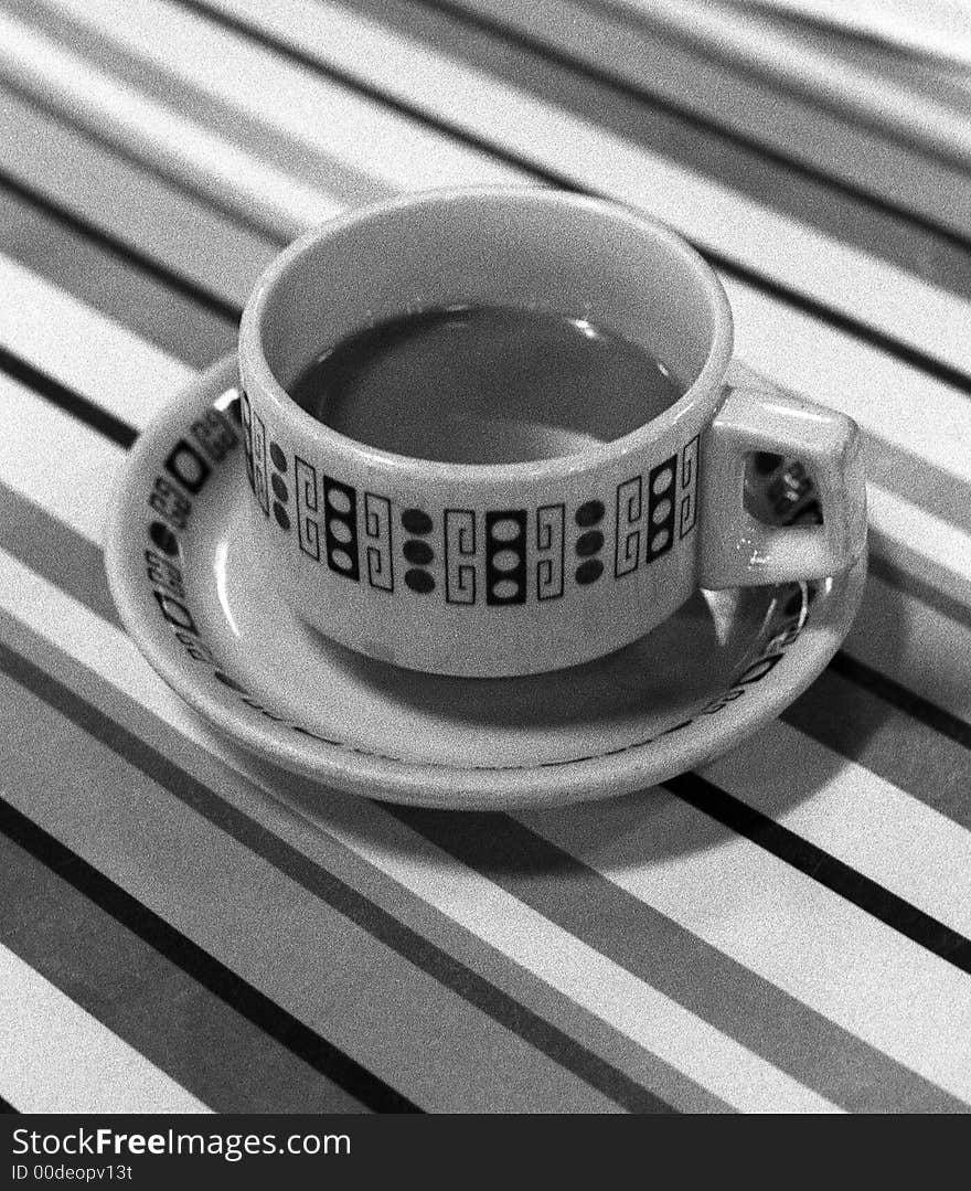 60s style tea cup on table bw shot. 60s style tea cup on table bw shot