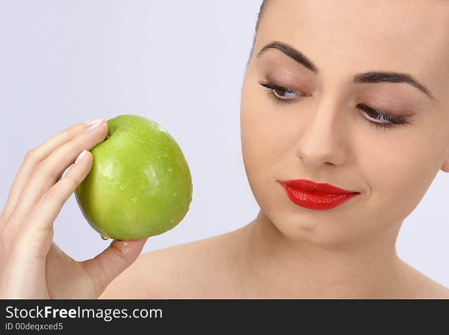 Portrait of beauty woman with apple