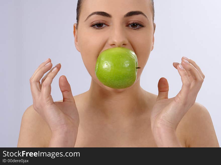 Portrait of beauty woman with apple