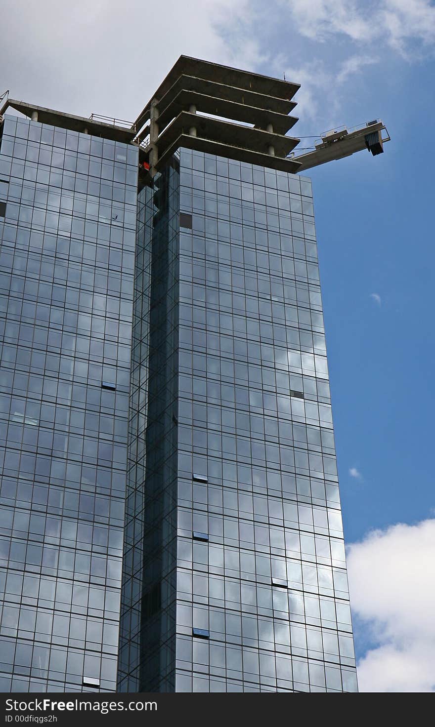 Modern building construction on a clear blue day