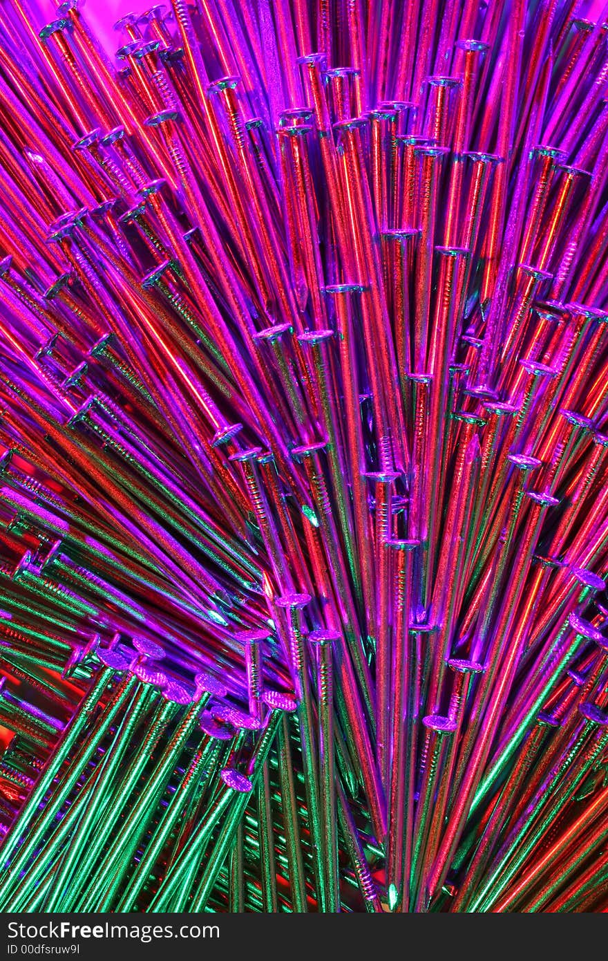 Arrangement of nails,with light from three directions, with different coloured filters before them. Arrangement of nails,with light from three directions, with different coloured filters before them