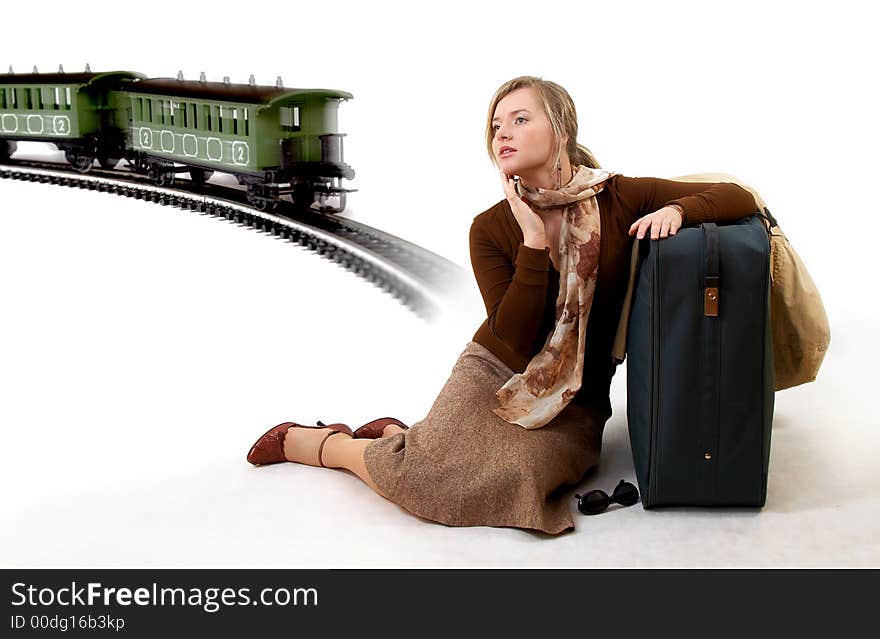 Woman with huge bag is waiting for train