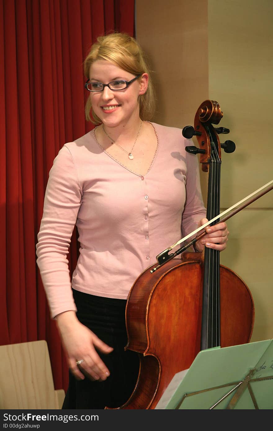 Female student at the Vienna music-conservatorium, having played a solo at an event for seniors (quiz). Female student at the Vienna music-conservatorium, having played a solo at an event for seniors (quiz)