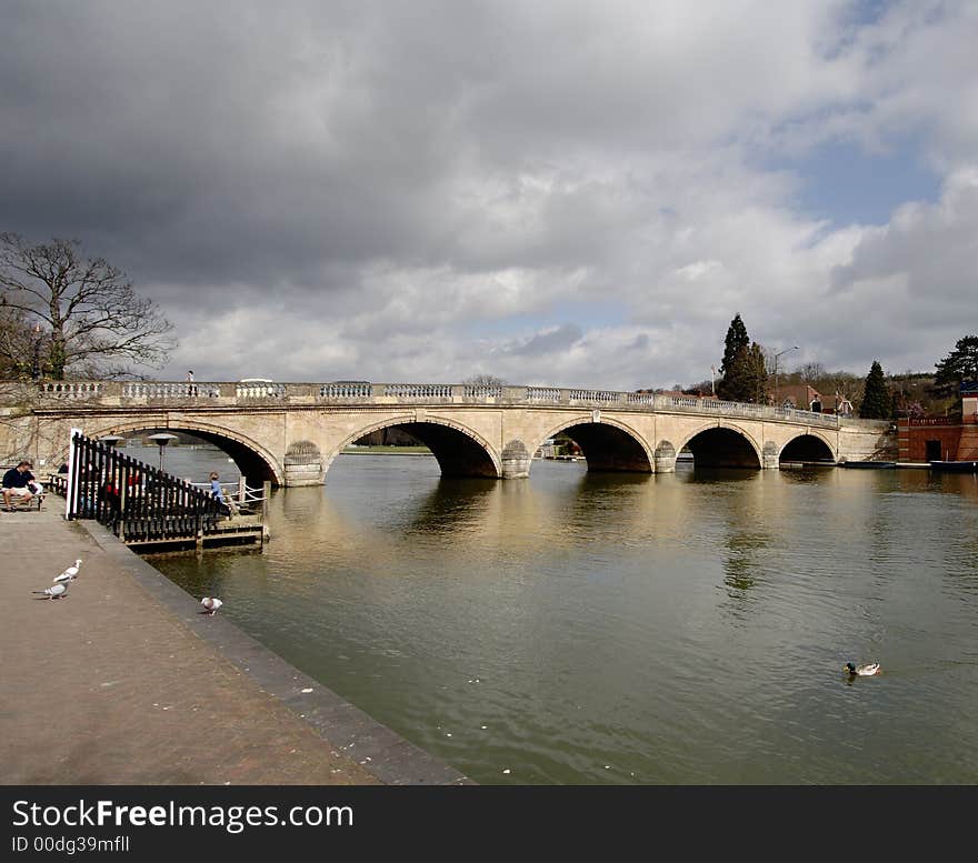 Storm Clouds over an Historic Road Bridge over the River Thames in England. Storm Clouds over an Historic Road Bridge over the River Thames in England