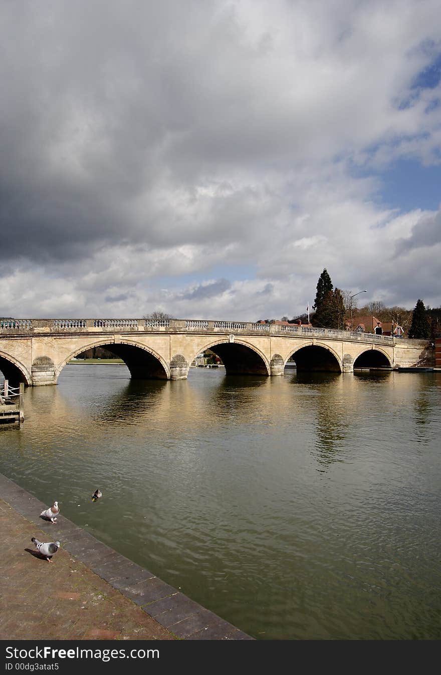 Storm Clouds over an Historic Road Bridge over the River Thames in England. Storm Clouds over an Historic Road Bridge over the River Thames in England