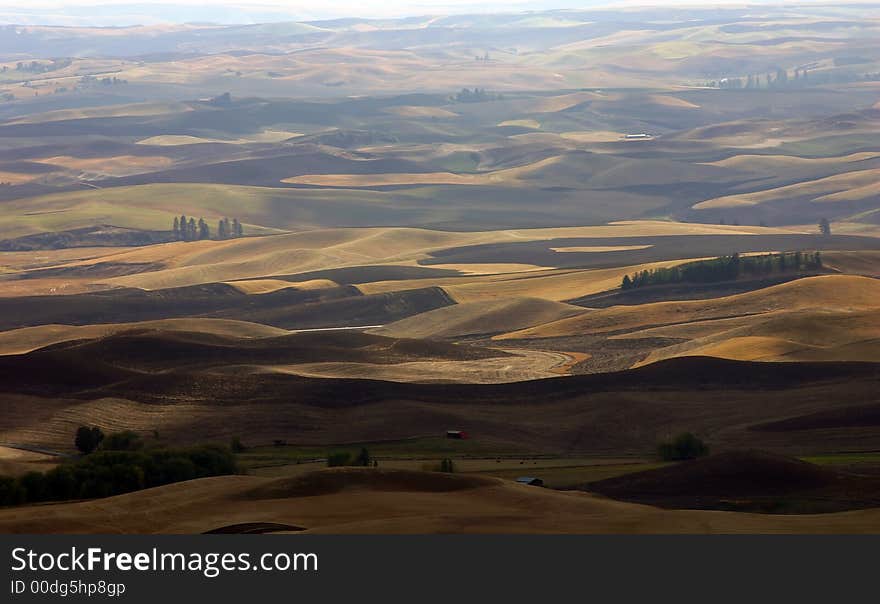 Farmlands and farmhouses in Autumn near Palouse, Eastern Washington. Farmlands and farmhouses in Autumn near Palouse, Eastern Washington