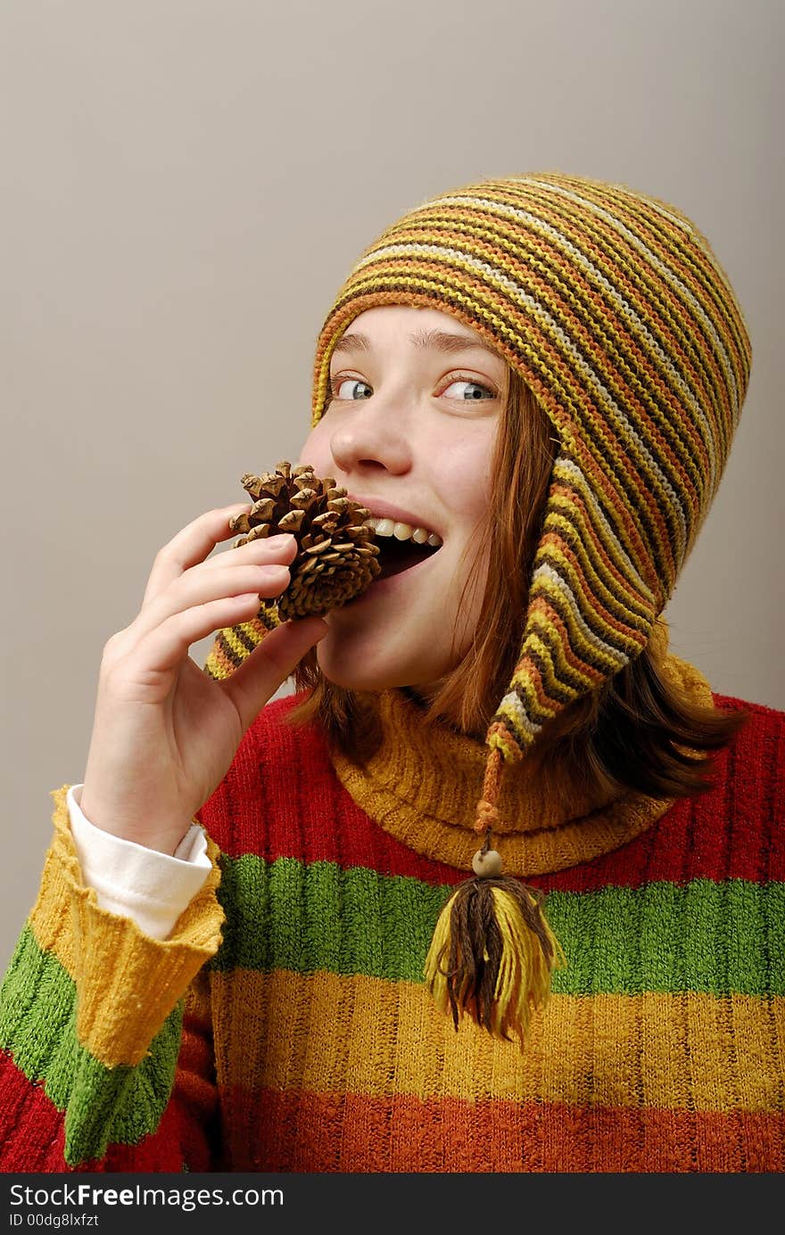 Girl in yellow cap trys fir apple. Girl in yellow cap trys fir apple