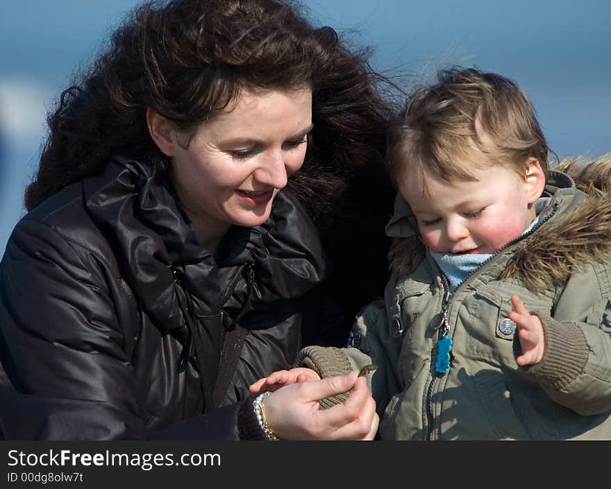 Mother and cute boy on the beach