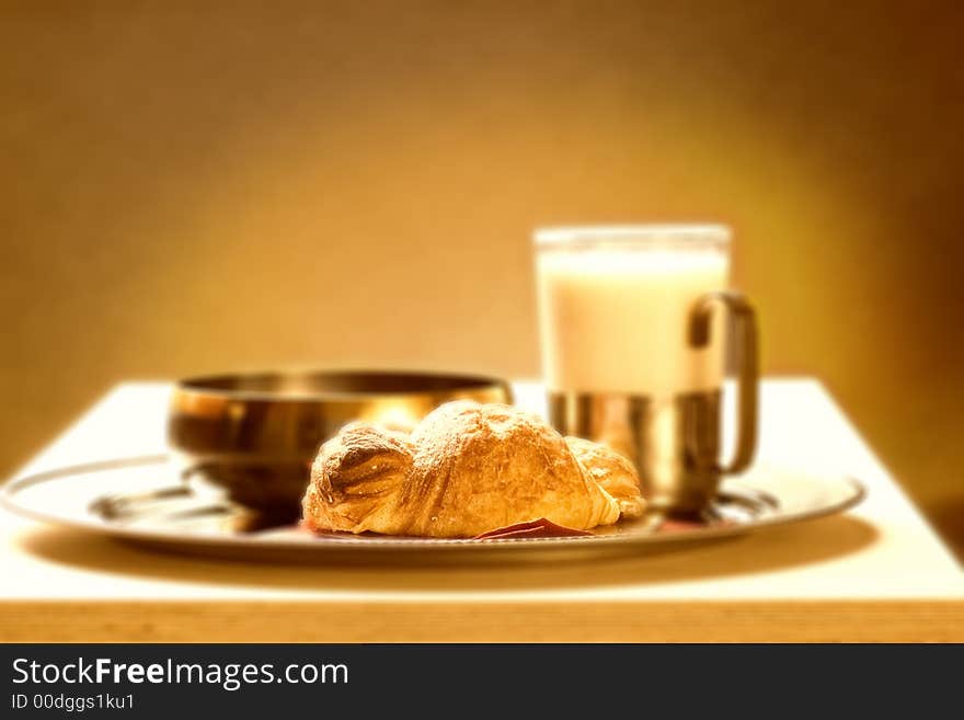 Sepia picture of a healthy breakfast (focus on croissante)