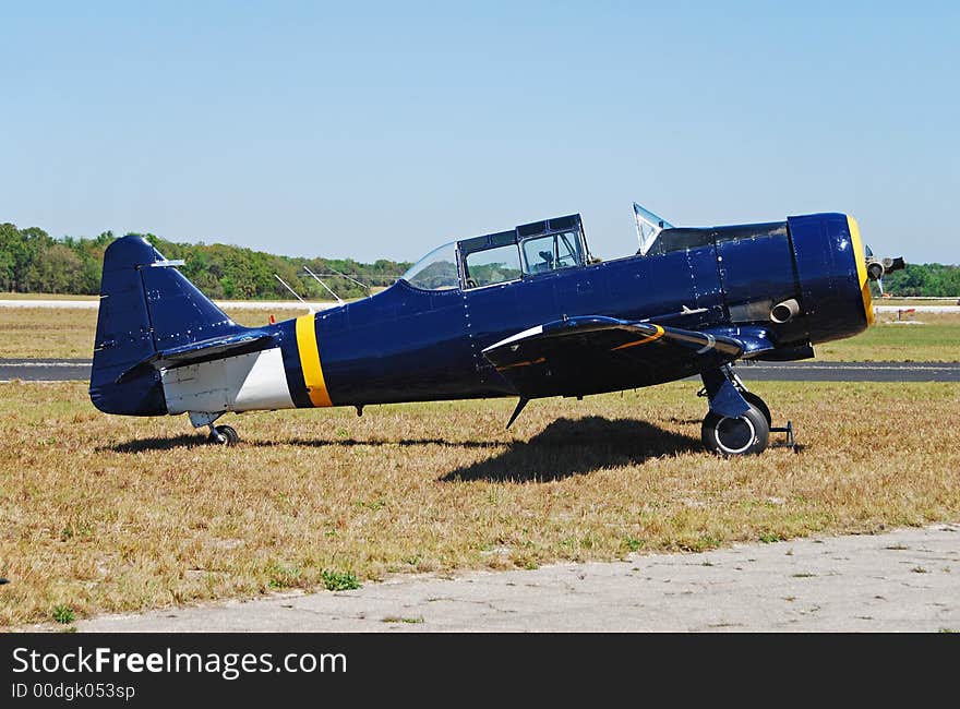 Historic Blue Airplane On The Ground