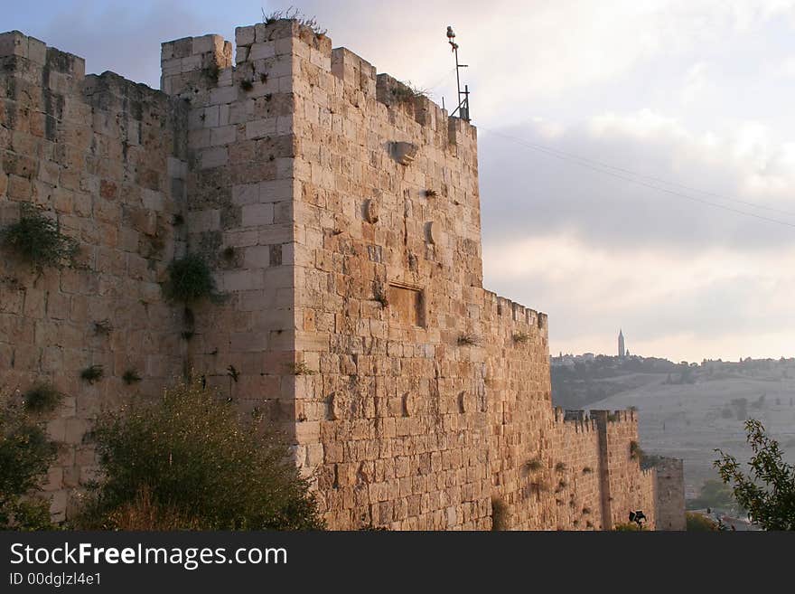 A fragment of the Old City Walls of Jerusalem at dawn. A fragment of the Old City Walls of Jerusalem at dawn.