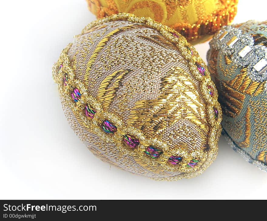 Easter egg instructed gold a thread and bright silver tapes (handmade) - isolated white background. Easter egg instructed gold a thread and bright silver tapes (handmade) - isolated white background