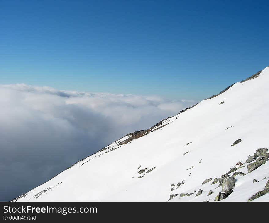 High Tatra, dramatic shot over the cloud formed by a temperature inversion. High Tatra, dramatic shot over the cloud formed by a temperature inversion