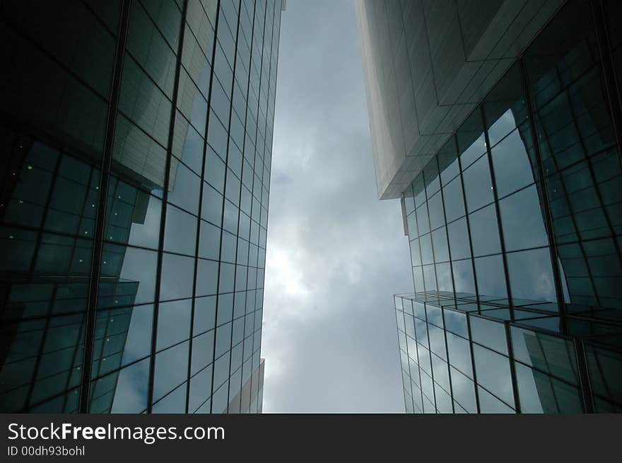 Gazing upwards between two modern buildings