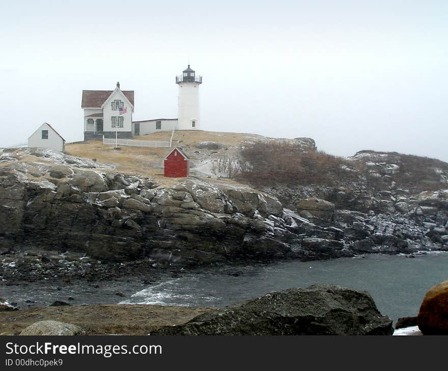 Cape Neddick - Nubble Light during a snowstorm. Cape Neddick - Nubble Light during a snowstorm