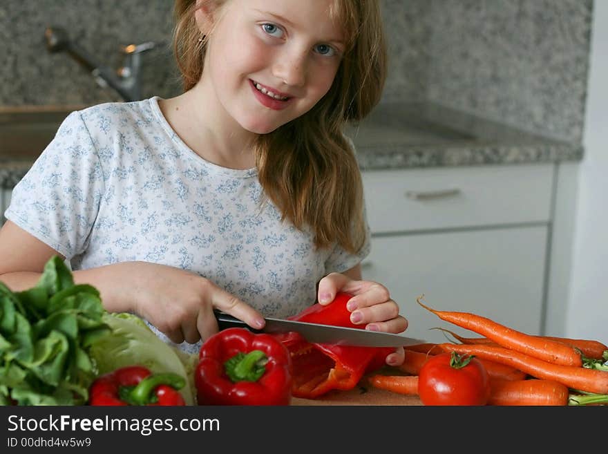 Girl learning to making the salad. Girl learning to making the salad