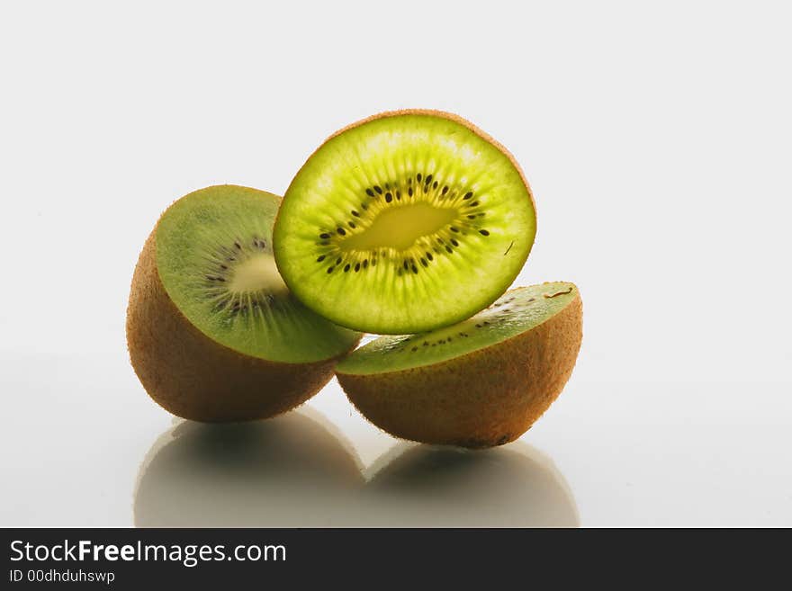 Cut slices kiwi on a white background. Cut slices kiwi on a white background