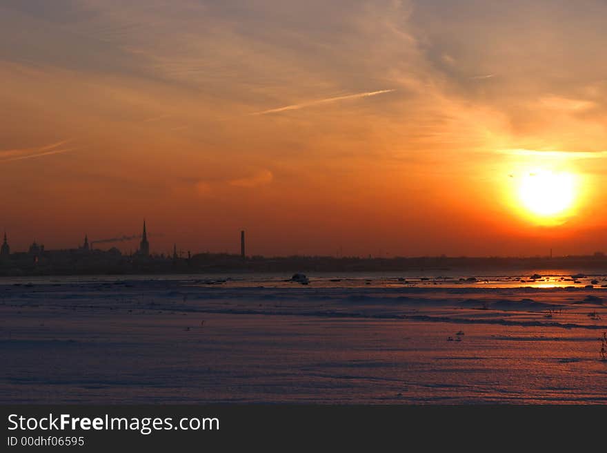 Beautiful January sunset above city in Estonia. Beautiful January sunset above city in Estonia