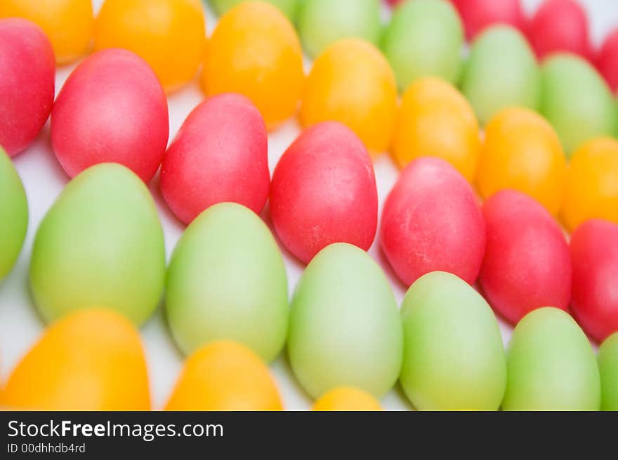 Pink, yellow and green egg shaped easter candy