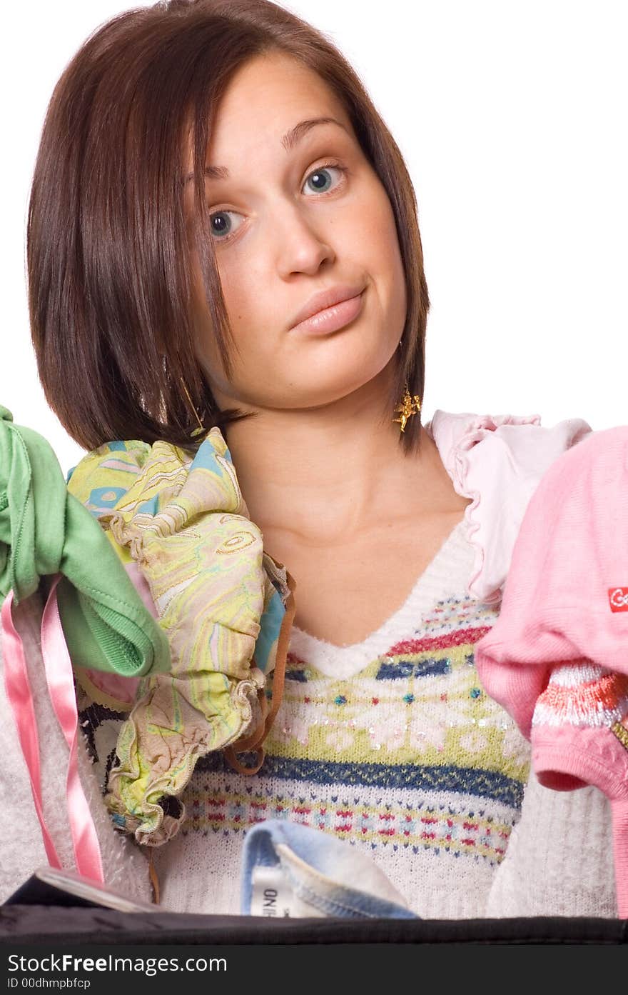 Picture of a Beautiful young girl packing her clothes. Picture of a Beautiful young girl packing her clothes