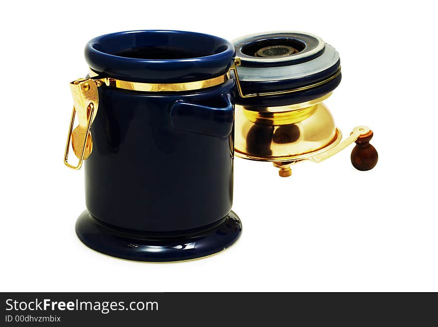 Opened classic coffee grinder with coffee grains on a white background with pretty shadow. Opened classic coffee grinder with coffee grains on a white background with pretty shadow