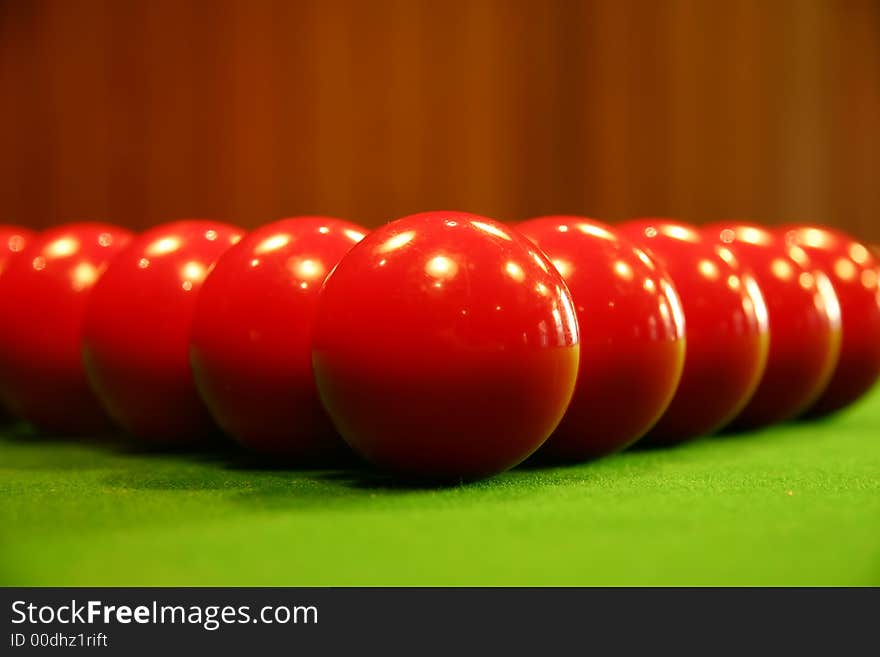 Colored billiard balls on a green billiard table. Colored billiard balls on a green billiard table