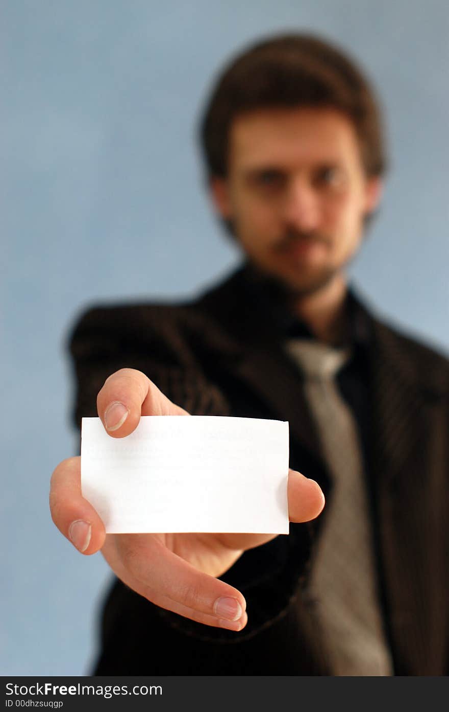 A businessman taking notes on a pad